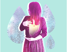 a woman holding a lighted candle