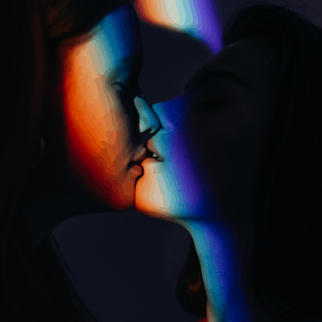 two white woman kissing with the rainbow color which means pride for sexuality