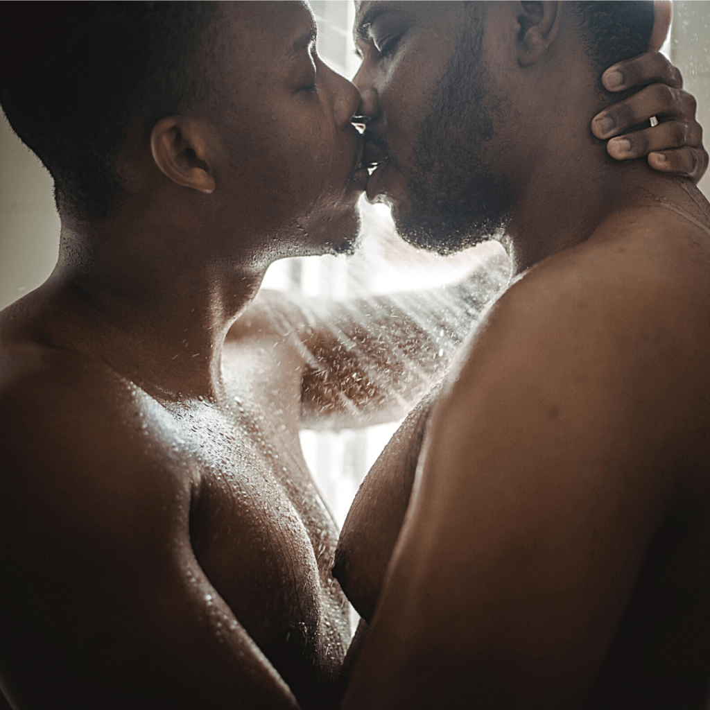 2 black men in the shower kissing
