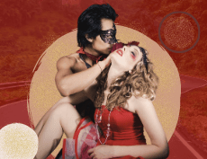 an Asian top less man wearing a sexy eye mask pulling a whote woman's hair wearing a red shor dress with some make up on her face and red lip stick with a background of a long road with trees