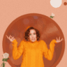 a featured image for the blog "Dating French vs North American" with an image of a woman wearing an orange sweater shrugging in a circle frame. White roses graphics and circles in orange and white color with dark orange dotted texture.