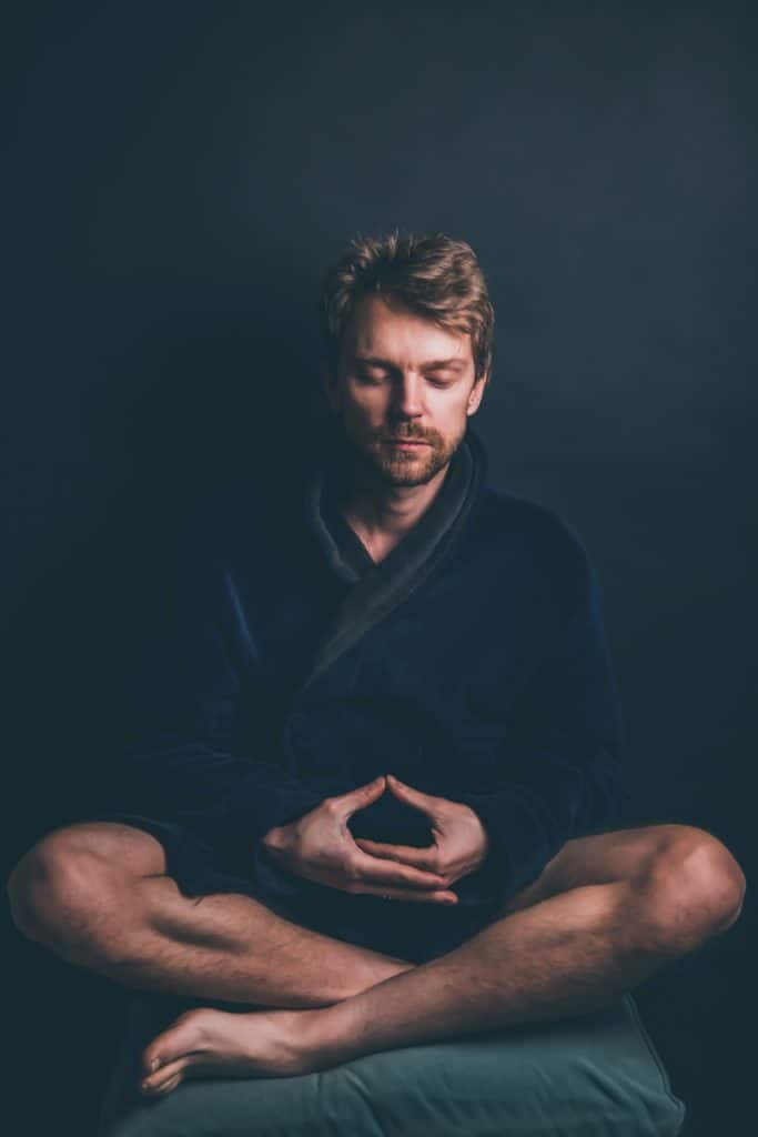 white man meditating